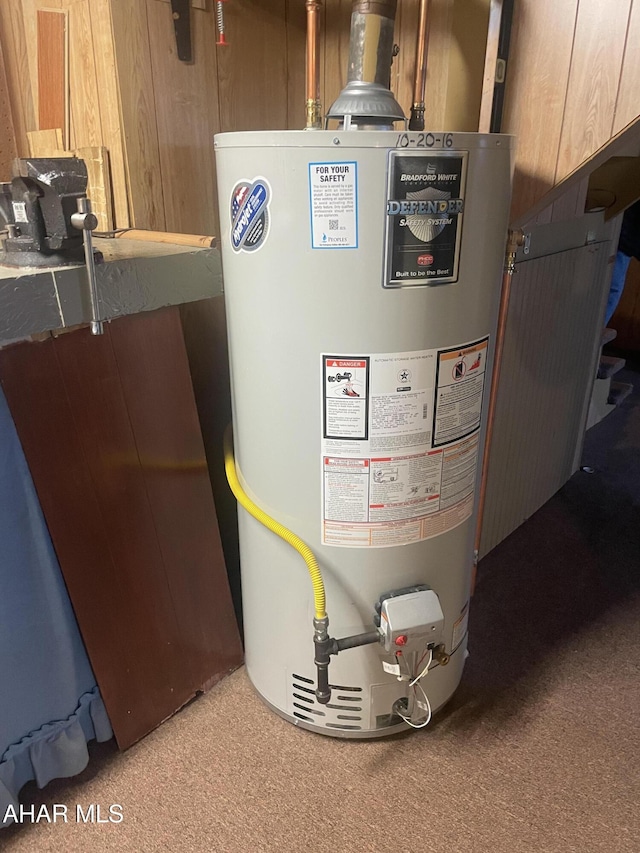 utility room featuring gas water heater