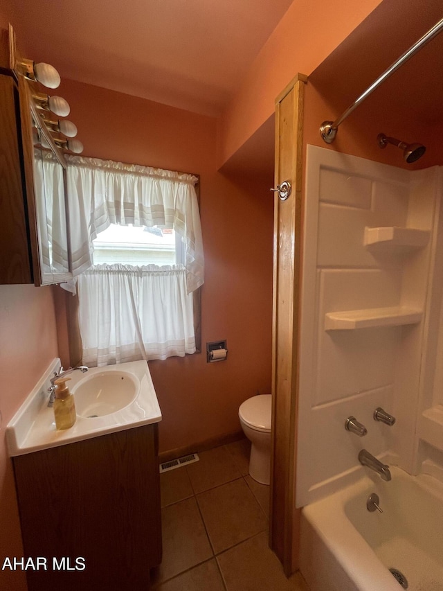 full bathroom featuring vanity, toilet, tile patterned floors, shower / bath combination, and visible vents