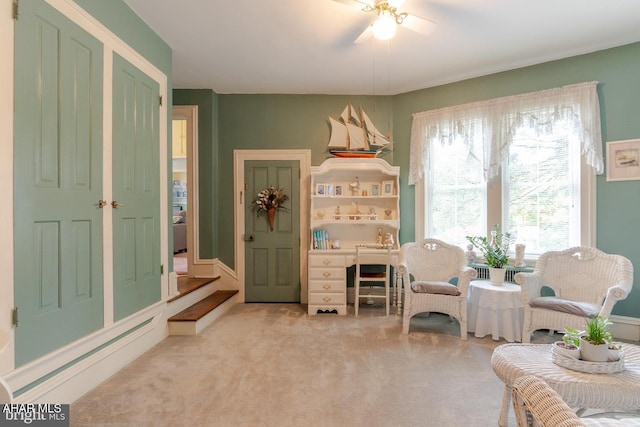 sitting room with light colored carpet