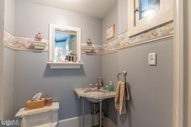 bathroom featuring sink and toilet