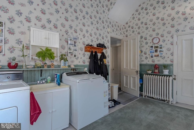 laundry area with washing machine and clothes dryer, sink, cabinets, radiator, and carpet floors