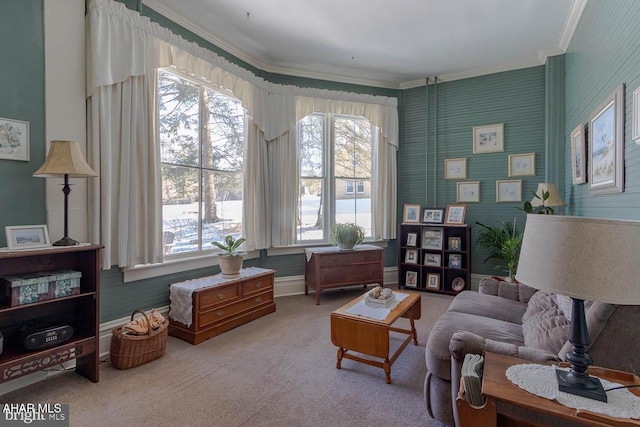 living area with ornamental molding, carpet, and a wealth of natural light