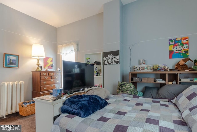 bedroom featuring carpet floors and radiator