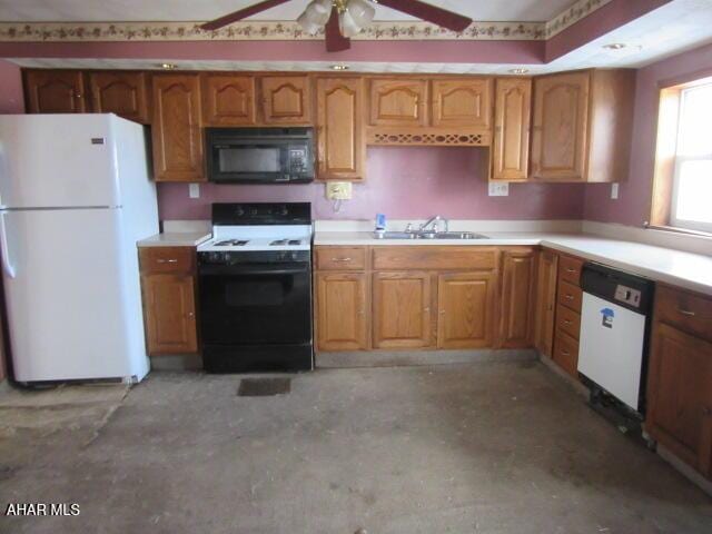 kitchen with ceiling fan, sink, and white appliances