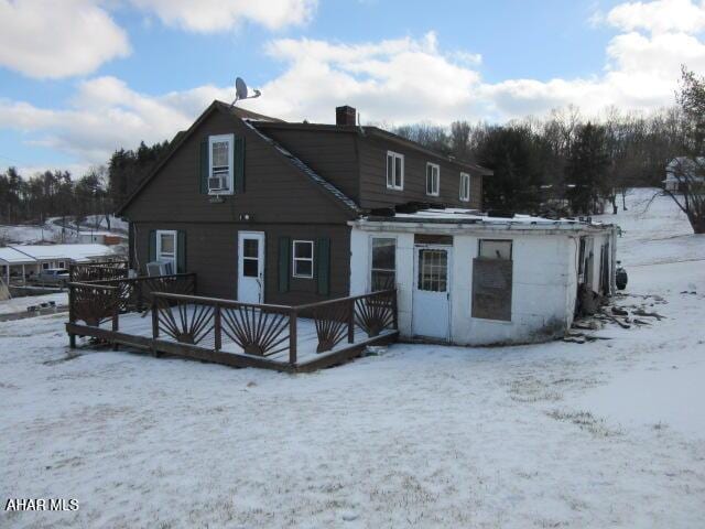 view of snow covered house