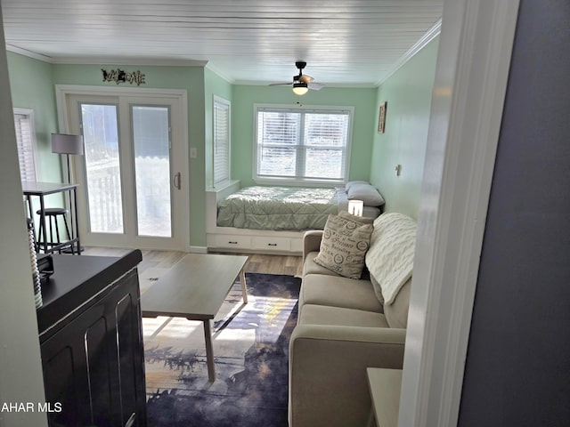 interior space with dark hardwood / wood-style flooring, ceiling fan, and ornamental molding