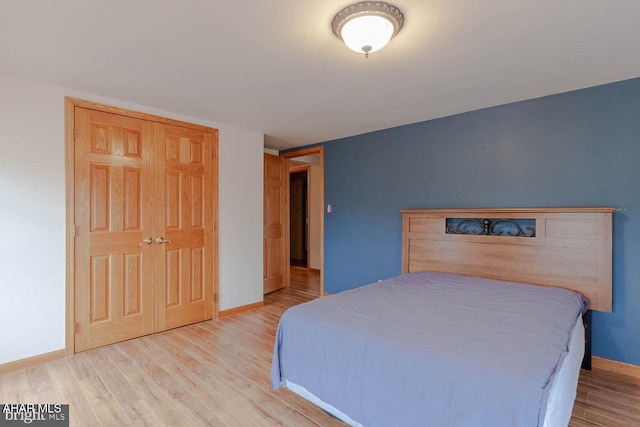 bedroom with hardwood / wood-style floors