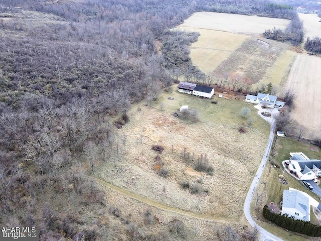 birds eye view of property with a rural view