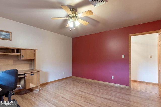 unfurnished office featuring ceiling fan and light hardwood / wood-style flooring