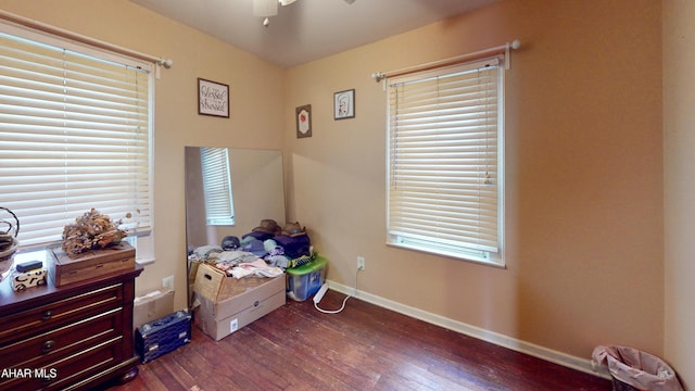 bedroom with dark wood-type flooring