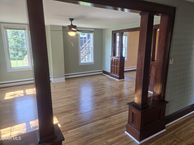 313 E John St, Bedford, PA 15522 - empty room with a baseboard radiator, a ceiling fan, and wood finished floors