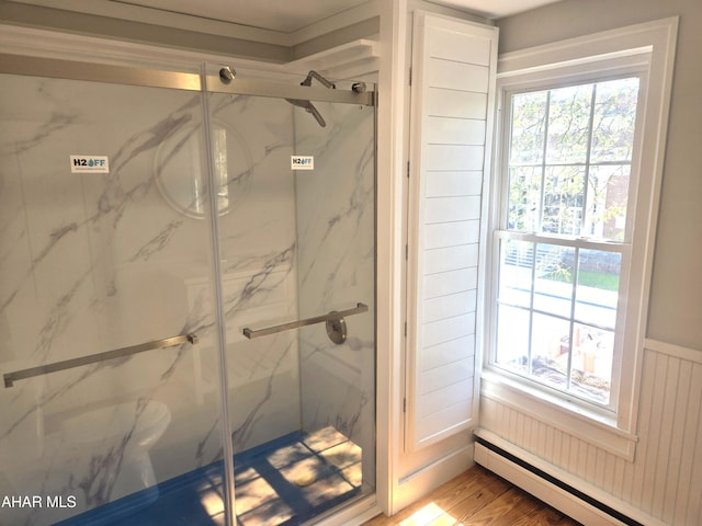313 E John St, Bedford, PA 15522 - bathroom with a baseboard heating unit, a marble finish shower, and wainscoting