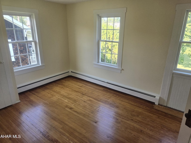 313 E John St, Bedford, PA 15522 - spare room featuring a baseboard radiator, plenty of natural light, and wood finished floors