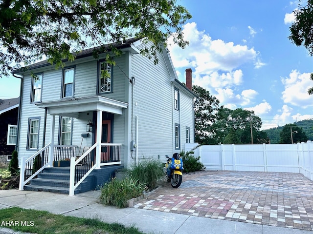 313 E John St, Bedford, PA 15522 - american foursquare style home featuring a chimney