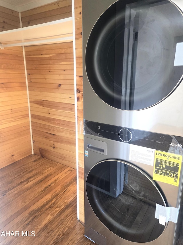 313 E John St, Bedford, PA 15522 - laundry area featuring stacked washer / drying machine, wood finished floors, and wooden walls