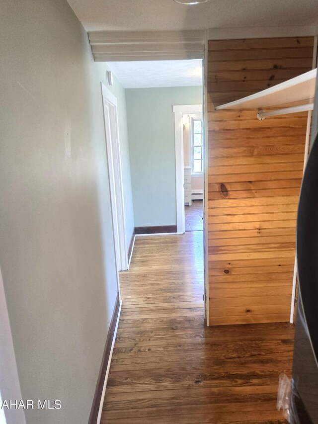 313 E John St, Bedford, PA 15522 - hall featuring wood finished floors and a baseboard heating unit