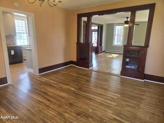313 E John St, Bedford, PA 15522 - unfurnished dining area with hardwood / wood-style flooring, a baseboard radiator, a chandelier, and a ceiling fan