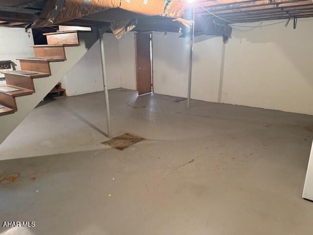 unfinished basement with stairs