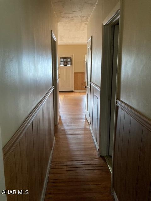 hallway with light wood-type flooring