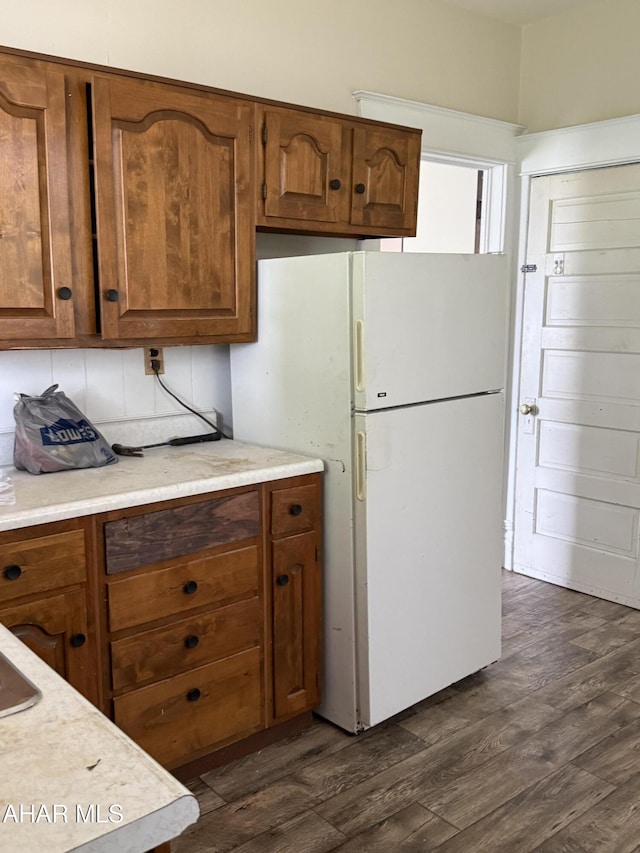 303 Cherry Ave, Altoona, PA 16601 - kitchen featuring dark wood-style flooring, freestanding refrigerator, and light countertops
