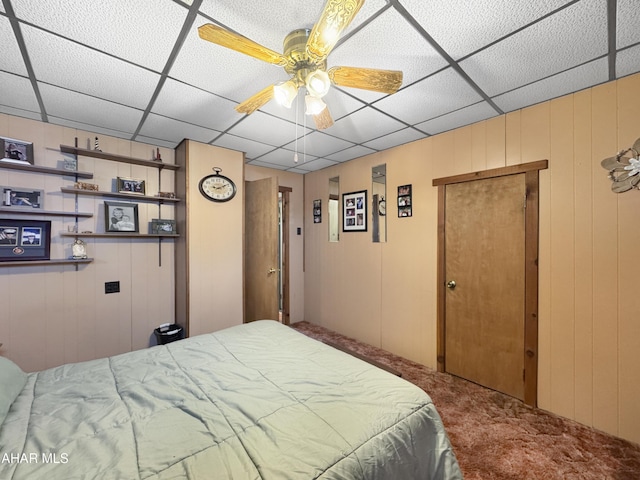 carpeted bedroom featuring a paneled ceiling