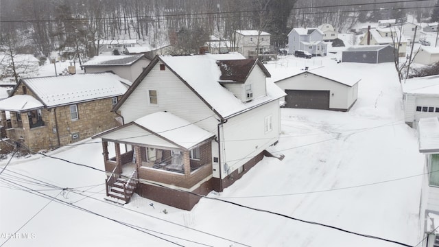 snowy aerial view featuring a residential view