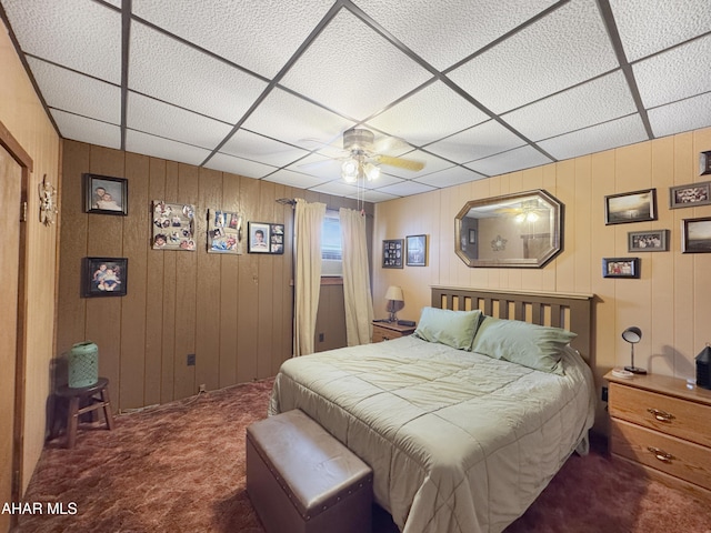 bedroom featuring a ceiling fan and dark carpet