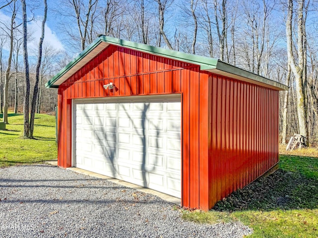 garage featuring a lawn