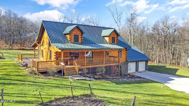 view of front of house with a front yard, a porch, and a garage