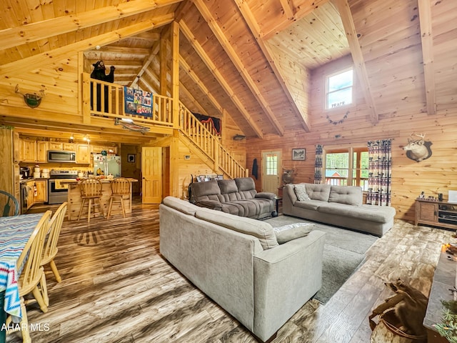 living room featuring hardwood / wood-style floors, wooden ceiling, and wooden walls