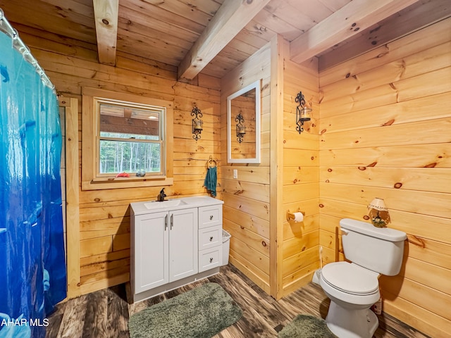 bathroom with wooden ceiling, wooden walls, hardwood / wood-style flooring, toilet, and beamed ceiling