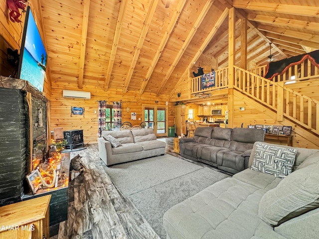 living room featuring a wood stove, beamed ceiling, high vaulted ceiling, wooden walls, and wood ceiling