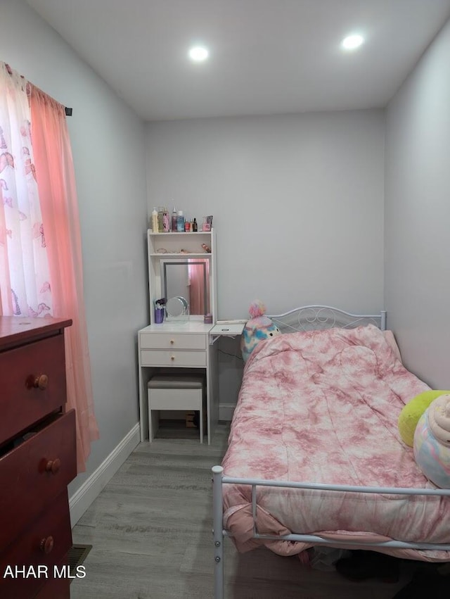 bedroom featuring light hardwood / wood-style floors