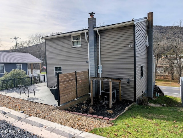 9802 Black Valley Rd, Everett, PA 15537 - rear view of house with a patio area and a chimney