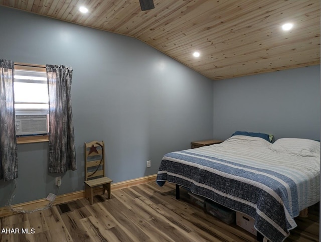 bedroom with hardwood / wood-style floors, vaulted ceiling, ceiling fan, and wooden ceiling