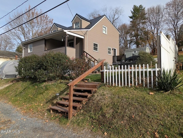 9802 Black Valley Rd, Everett, PA 15537 - view of side of home with a metal roof and stairway