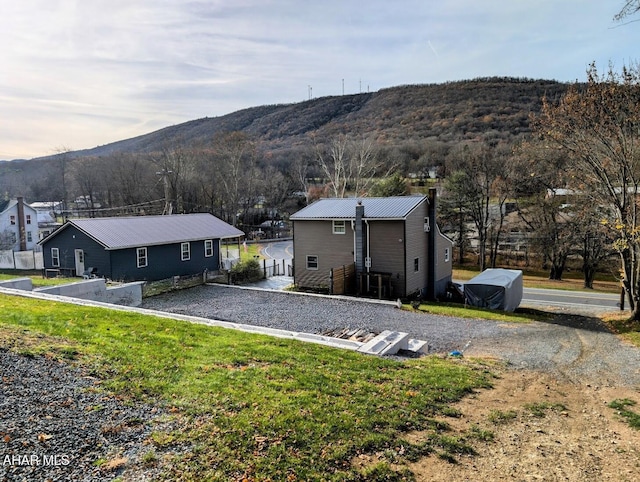 9802 Black Valley Rd, Everett, PA 15537 - rear view of house featuring a mountain view, a metal roof, and a yard