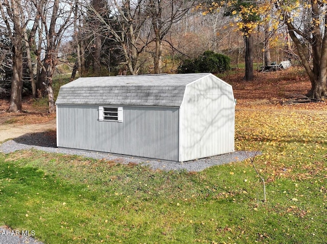 view of outbuilding with a lawn