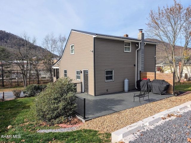 9802 Black Valley Rd, Everett, PA 15537 - back of property featuring a chimney and a deck with mountain view