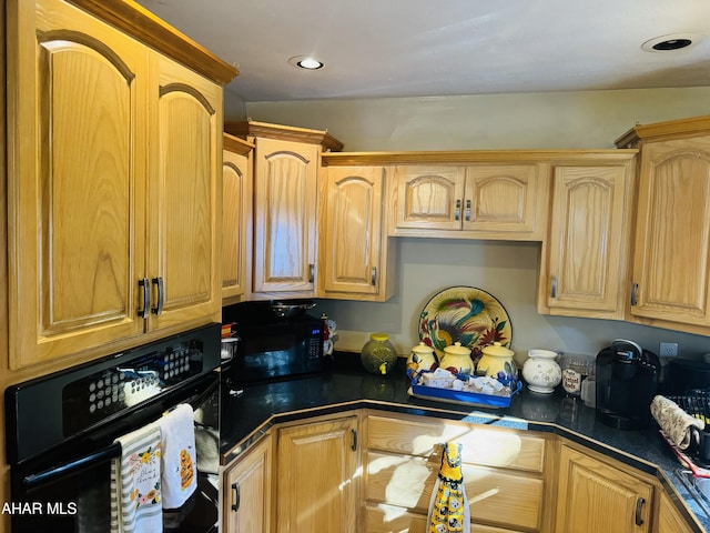 kitchen featuring lofted ceiling and black appliances