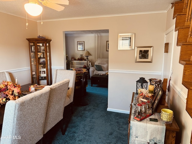 interior space with crown molding, ceiling fan, a textured ceiling, and dark colored carpet