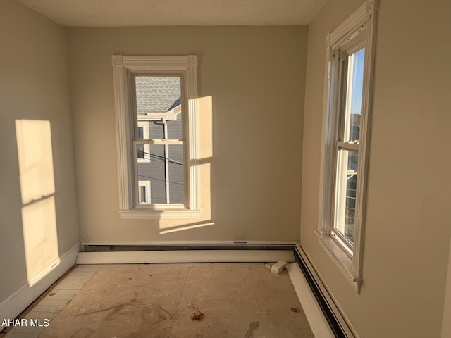 spare room with a healthy amount of sunlight and a textured ceiling