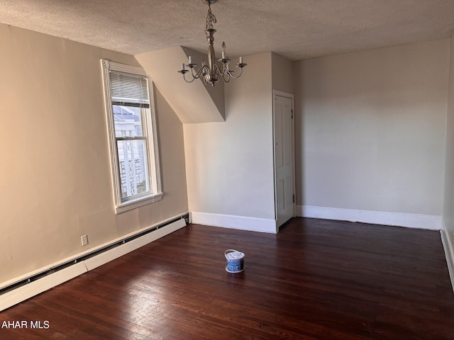 bonus room with baseboard heating, dark hardwood / wood-style flooring, a chandelier, and a textured ceiling