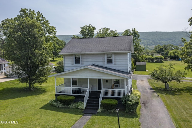 2513 Quail Ave, Altoona, PA 16602 - view of front of property with covered porch, a front yard, driveway, and a mountain view