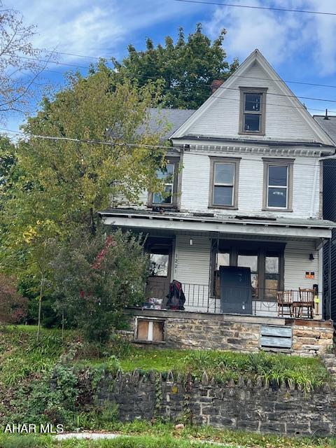 1221 N 4th Ave, Altoona, PA 16602 - view of front facade featuring a porch