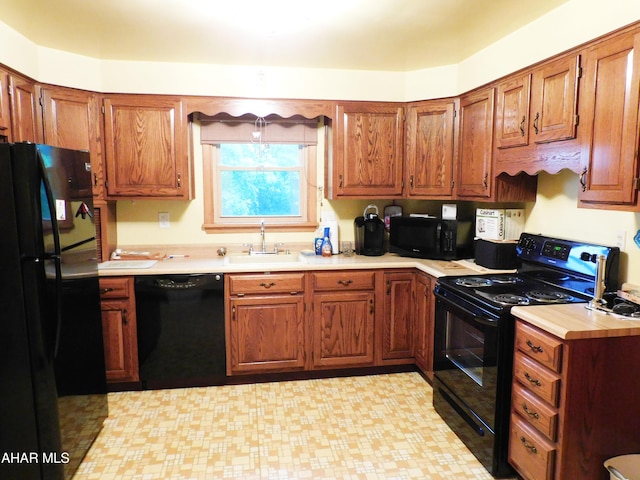 315-323 E 23rd Ave, Altoona, PA 16601 - kitchen with black appliances, light countertops, and brown cabinets