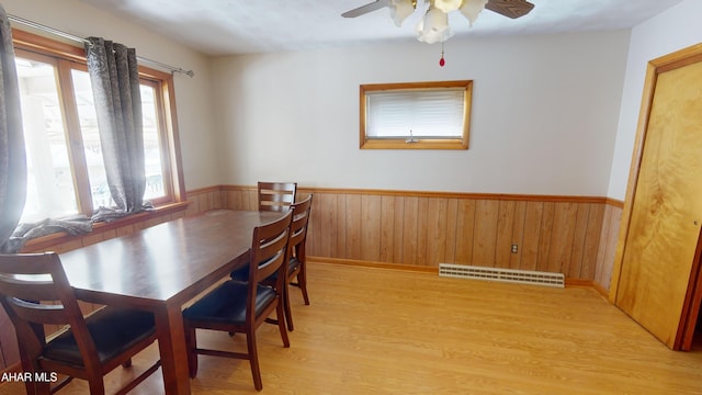 dining room with ceiling fan and light wood-type flooring