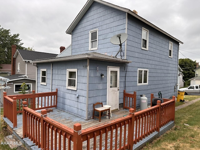 back of property featuring a deck