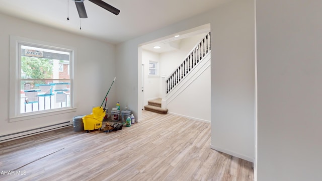 2602 W Chestnut Ave, Altoona, PA 16601 - interior space featuring light wood finished floors, ceiling fan, stairs, a baseboard heating unit, and recessed lighting