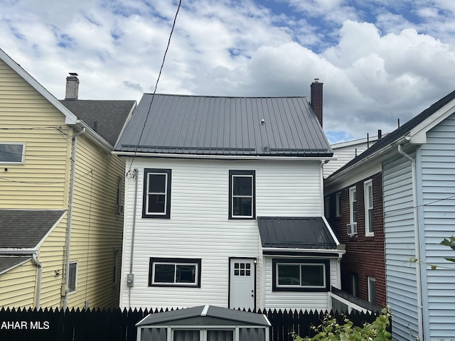 2602 W Chestnut Ave, Altoona, PA 16601 - rear view of house featuring a metal roof and a chimney